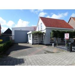 vrijstaande woning met hobbyruimte , garage, bedrijfsruimte