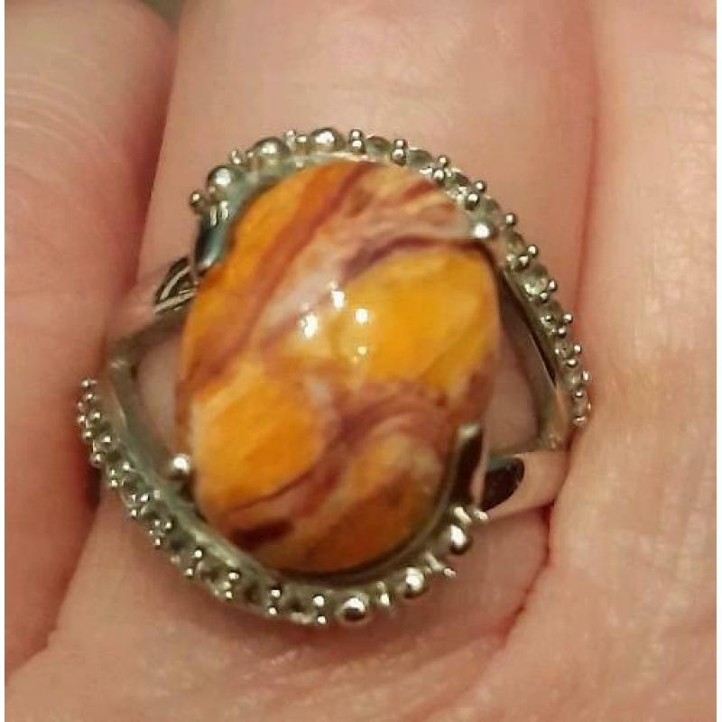 925 zilveren ring met Lion Paw Shell en witte topaas