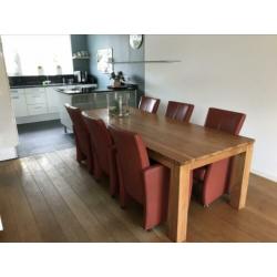 6 (Eetkamer)fauteuils op geremde parketwielen.