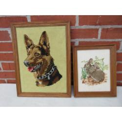 geborduurde schilderijtjes van herdershond en konijntjes