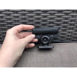 Zwarte PlayStation 3 met games en 2 controllers
